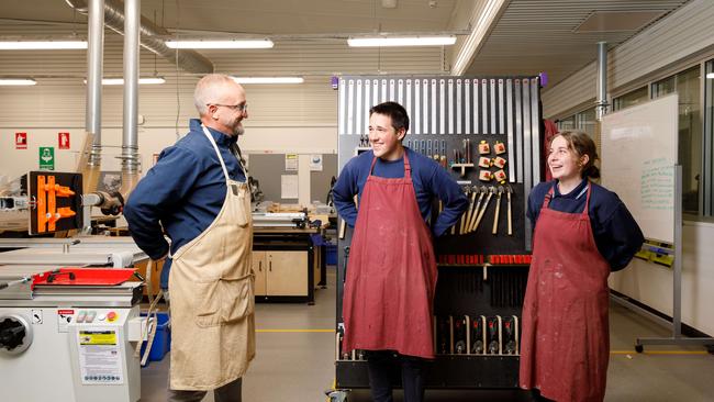 Craig Mulder, with year 11 students Cullen Hoyn and Avalon Mooney in the school’s brand new industrial arts building which replaces one which burnt down in 2018. Picture by Max Mason-Hubers