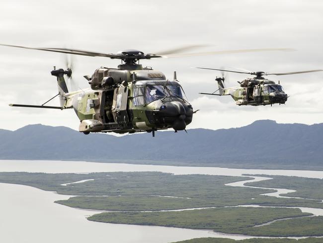 Australian Army MRH 90 Taipans from the 5th Aviation Regiment fly in formation deploying soldiers from the 3rd Brigade to Jungle Training Wing, Tully, Queensland during Exercise Kalimantan. *** Local Caption *** Soldiers from the 3rd Brigade’s 3rd Battalion, The Royal Australian Regiment’s Bravo Company conducted Exercise Kalimantan, a training activity in preparation for their participation on Joint Army Training Team – Philippines in mid-August. The soldiers were uplifted by 5th Aviation Regiment MRH90 assets and taken from Lavarack Barracks to Tully Far-North Queensland before conducting jungle offensive operations, jungle to urban clearances, and basic jungle survival and medical treatment.