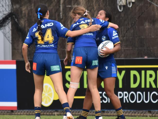 Nikita E (right) is congratulated by Jasmine Rorani (left) and Danielle Seckold. Picture: Sean Teuma