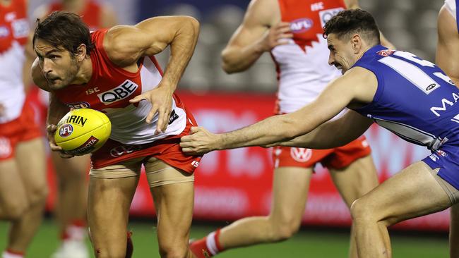 Josh Kennedy barges through for the Swans. Picture: Michael Klein