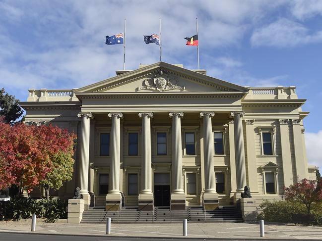 Flags flying half mast at City Hall. Marchers took part in an Anzac Parade through Malop Street to Johnstone Park on Anzac Day. Crowds lined the street but there were none of the usual formalities at the finale. Picture: Alan Barber