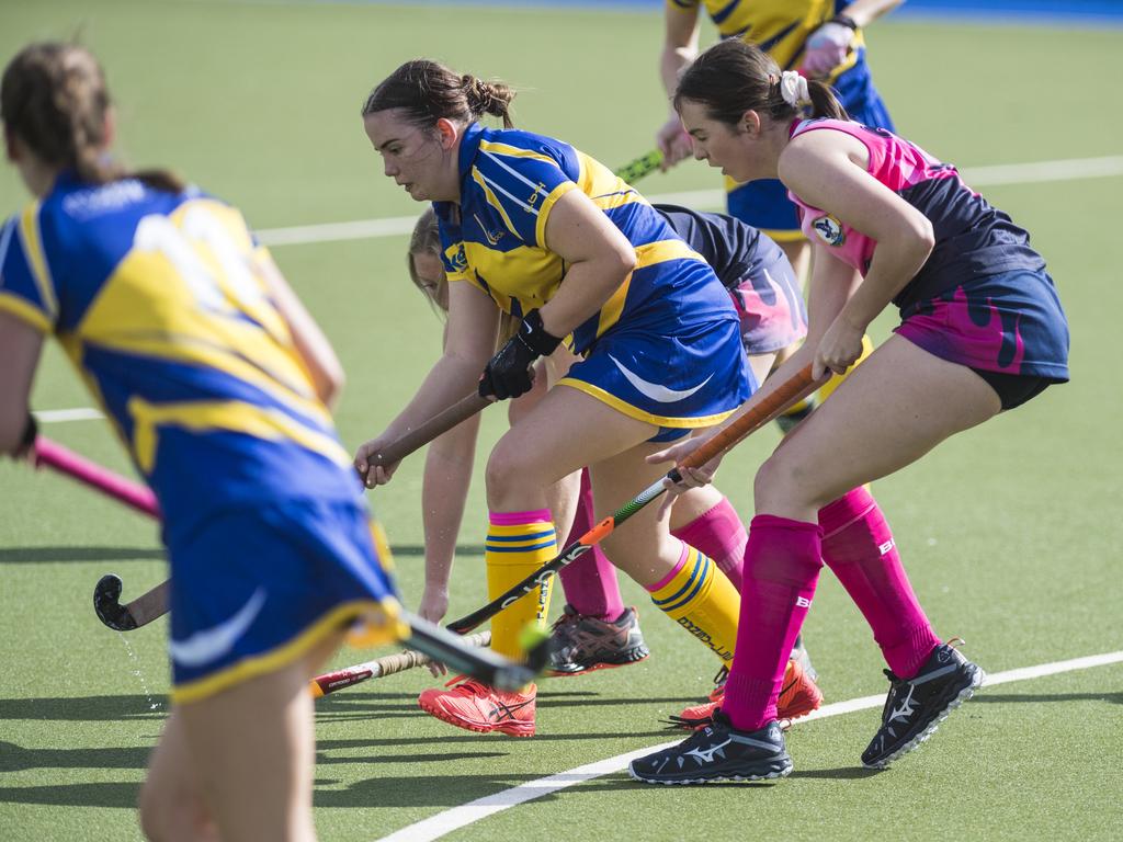 Mikaela Stark (centre) of Townsville against Toowoomba 2 in Hockey Queensland Championships at Clyde Park, Saturday, May 1, 2021. Picture: Kevin Farmer