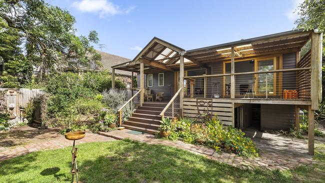 A large veranda looks over the deep backyard.