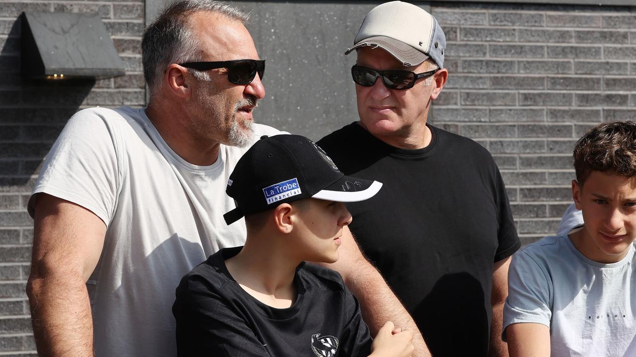 Anthony Rocca (left) and Saverio Rocca with their sons at Collingwood’s open training session on Thursday. Picture: Michael Klein