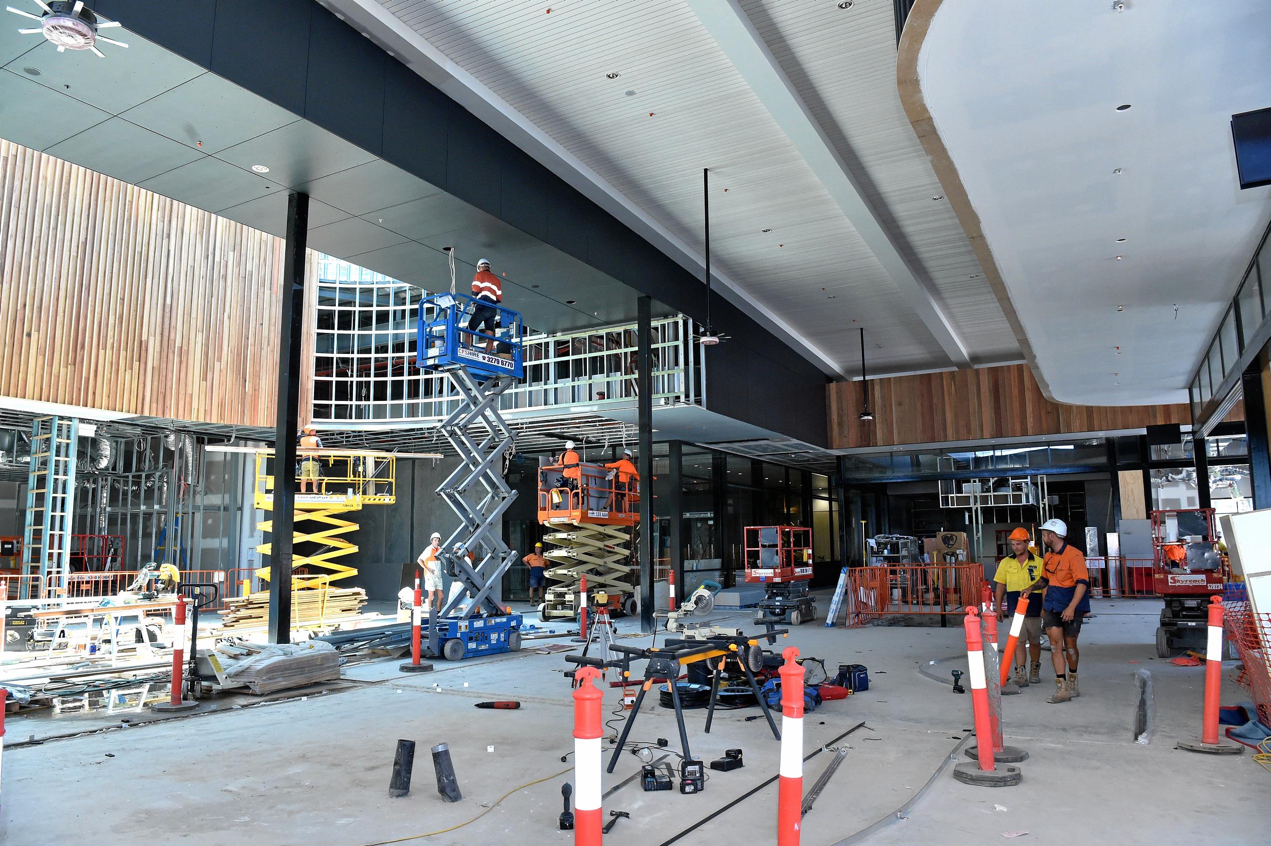 Full steam ahead for the opening of the Stockland Birtinya Shopping Centre. Constuction workers put the final pieces together for the grand opening in a couple of weeks. Picture: Warren Lynam