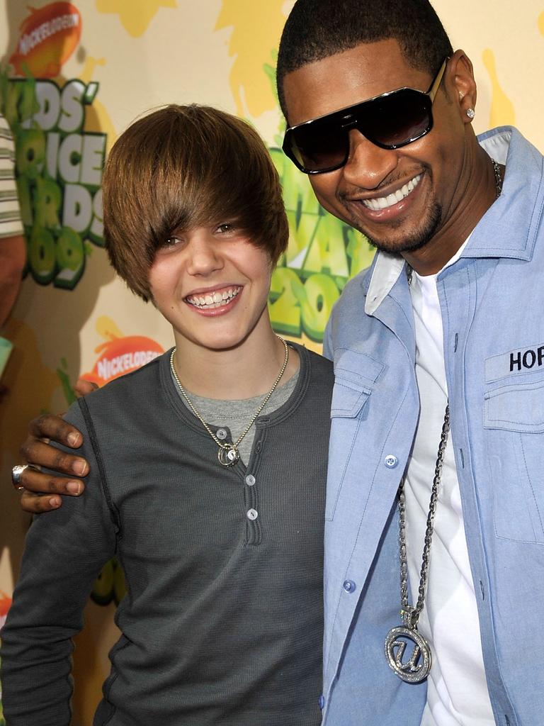 Justin Bieber and Usher pictured in 2009. Picture: Kevin Winter/Getty Images