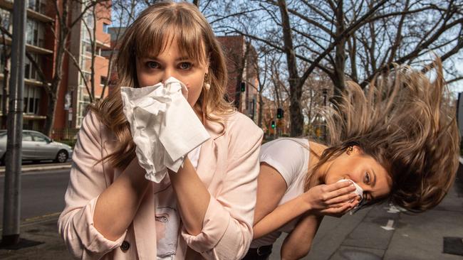 Katelin Rice, 22, and Yasmin Cinelli, 23, on Frome Rd which is lined with London plane trees that spark allergies. Picture: Brad Fleet