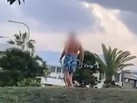 Wild footage has emerged of a northern NSW man armed with a baseball bat charging towards two young boys on e-bikes, with one screaming âtrying to hit little kids are ya?â. Picture: Supplied.