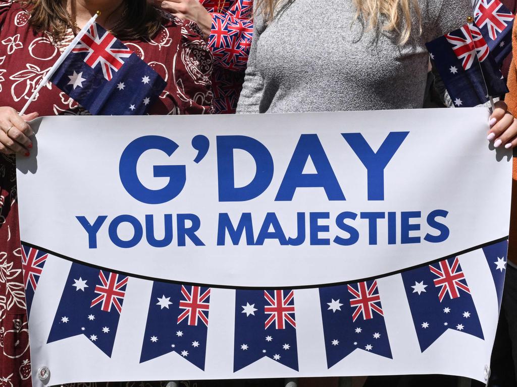 A sign is displayed as people wait to greet King Charles III and Queen Camilla outside St Thomas' Anglican Church. Picture: AFP