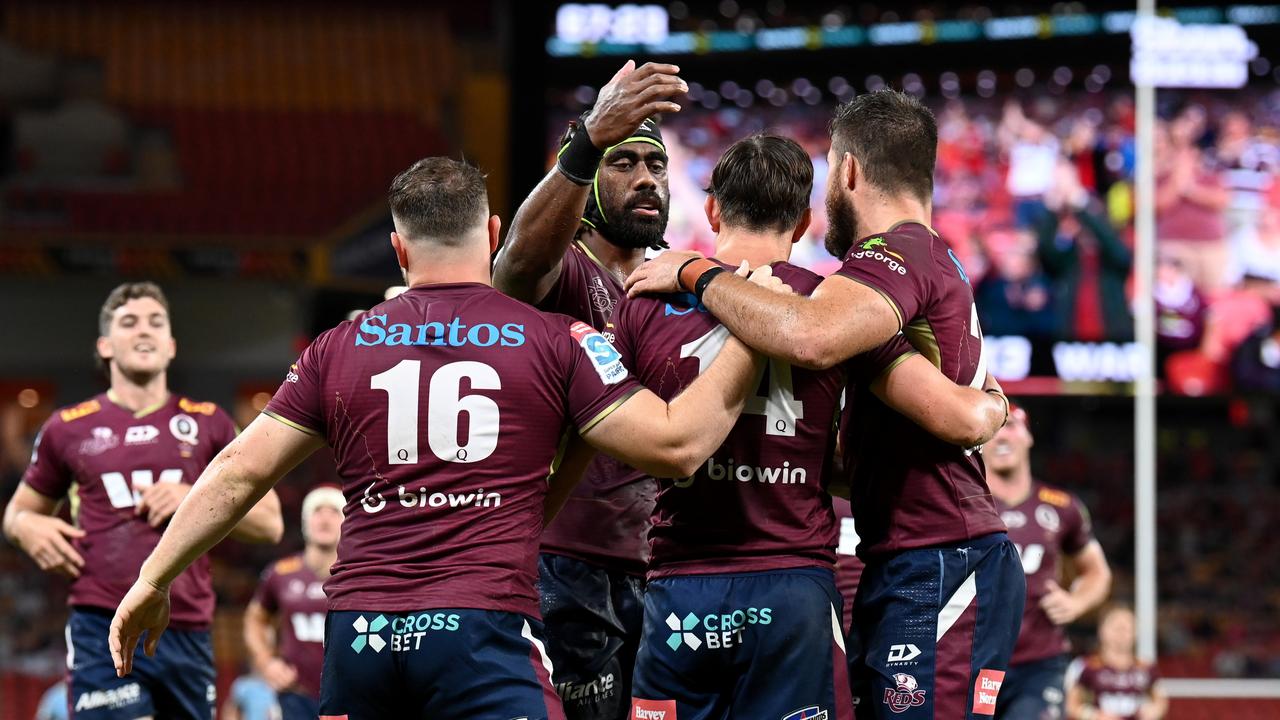 Reds players celebrate a try during Queensland’s win over the NSW Waratahs. Picture: Dan Peled/Getty Images