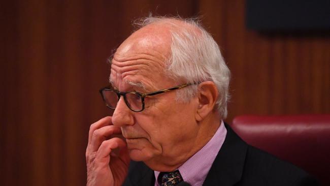 Commissioner Hon. Raymond Finkelstein AO QC is seen during Victoria's royal commission into Crown Casino, in Melbourne, Wednesday, March 24, 2021. The inquiry will look at whether Crown has broken the law and if it is suitable to hold a gaming licence in Victoria. (AAP Image/James Ross) NO ARCHIVING