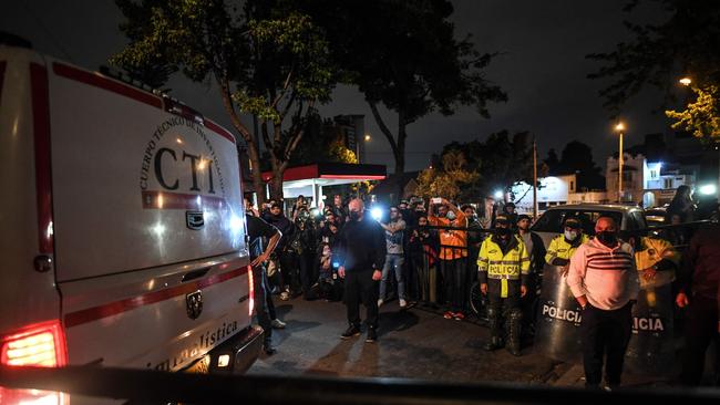 Member's of the Technical Investigation Team transport Foo Fighters' drummer Taylor Hawkins body from a hotel in Bogota. Picture: AFP.