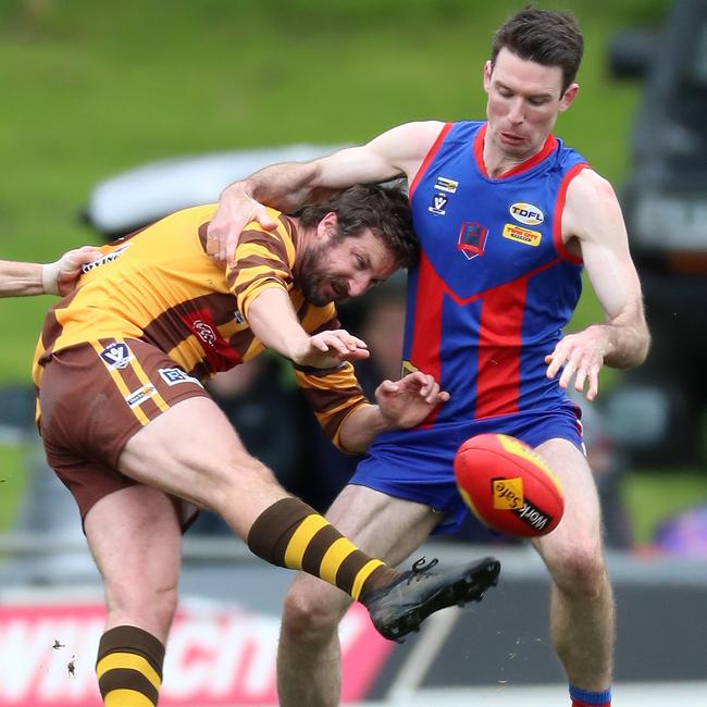 Kiewa Sandy-Creek’s Callum Turner is met head on by Beechworth’s Mitch Anderson.