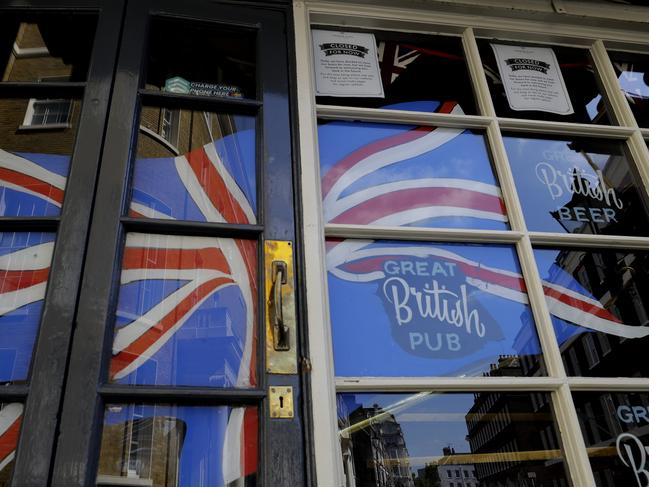 A Union flag in the window of a closed pub, as London is in lockdown to prevent the spread of coronavirus. Picture: Kirsty Wigglesworth