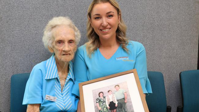 Joyce Swinton, 92, with FNQ Hospital Foundation CEO Gina Hogan hold a photo of the family members she lost to cancer. Picture: Sandhya Ram