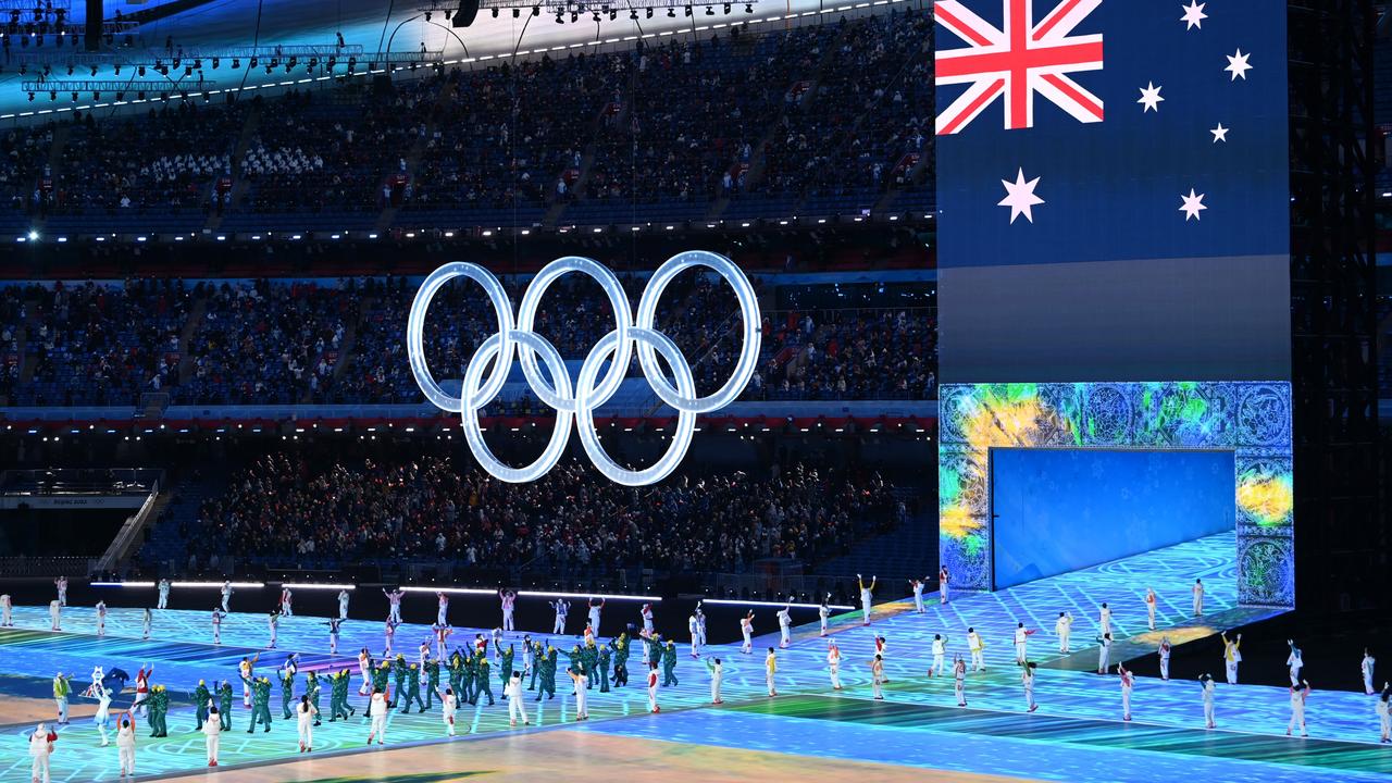 Team Australia enters the stadium featuring a large Olympic ring logo. Picture: Matthias Hangst/Getty Images.