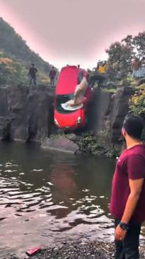 Car with child inside plunges over waterfall in dramatic video