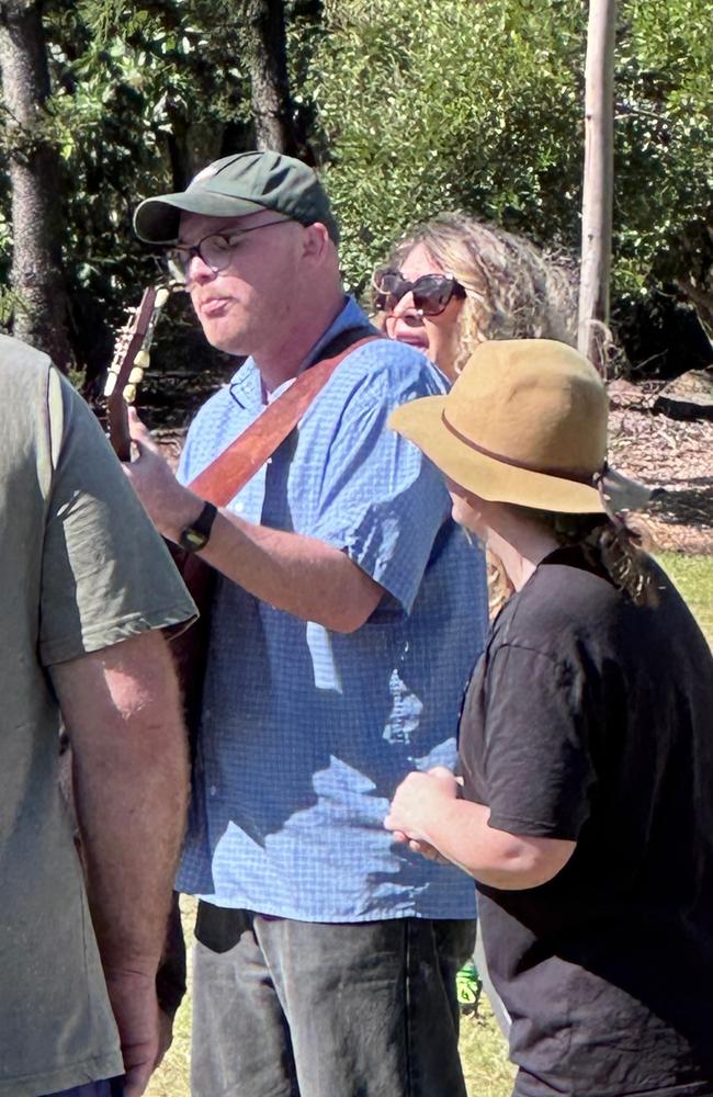 Members of the Oasis Church gathered at Kershaw Gardens, Rockhampton, after a fire destroyed their church.