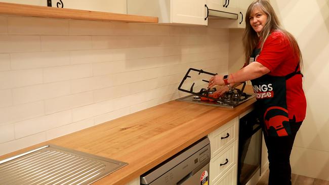 Bunnings team member Amanda Dolan makes last minute touches to the kitchen department of the new Bunnings opening this weekend in Gladesville. (AAP IMAGE / Angelo Velardo)