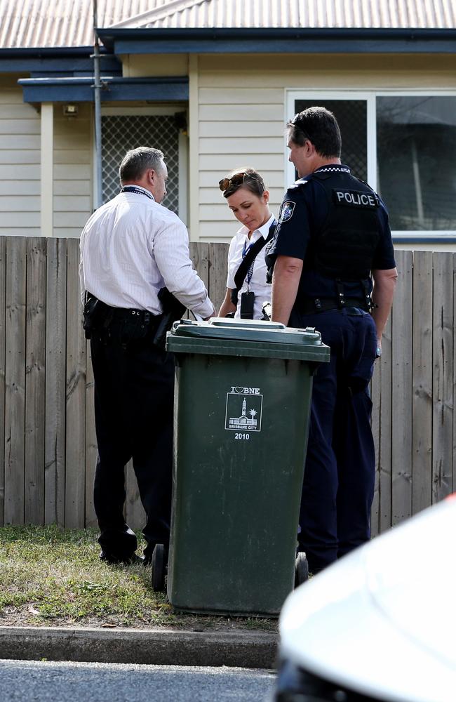 Police at a home where the brothers were living. File picture