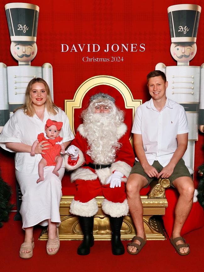 Cutest spring baby winner Poppy with parents Hannah and Simon Potts in her first Santa photo. Picture: Supplied