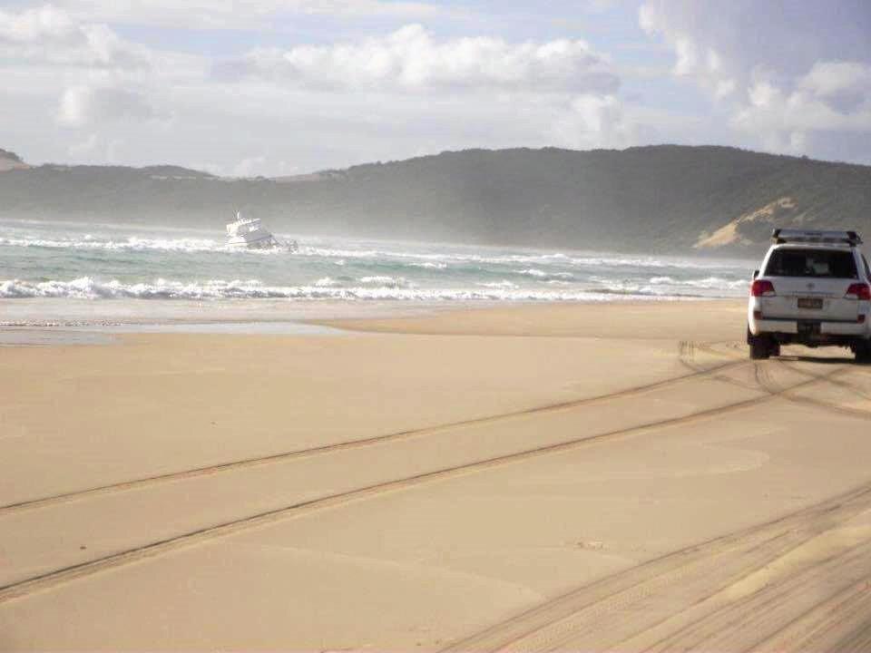 A luxury Riviera cruiser has been run aground on Fraser Island after taking water overnight. Picture: Contributed