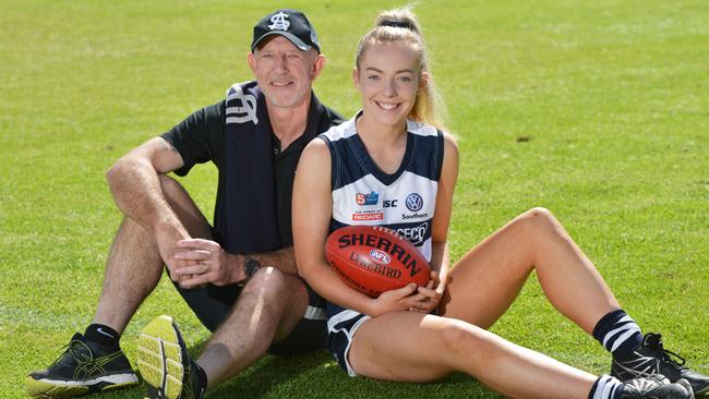 Former South Adelaide player Andrew Brockhurst and his daughter Emily. Emily, 17, became the first daughter of a past player make her debut in the SANFLW this month Picture: AAP/Brenton Edwards