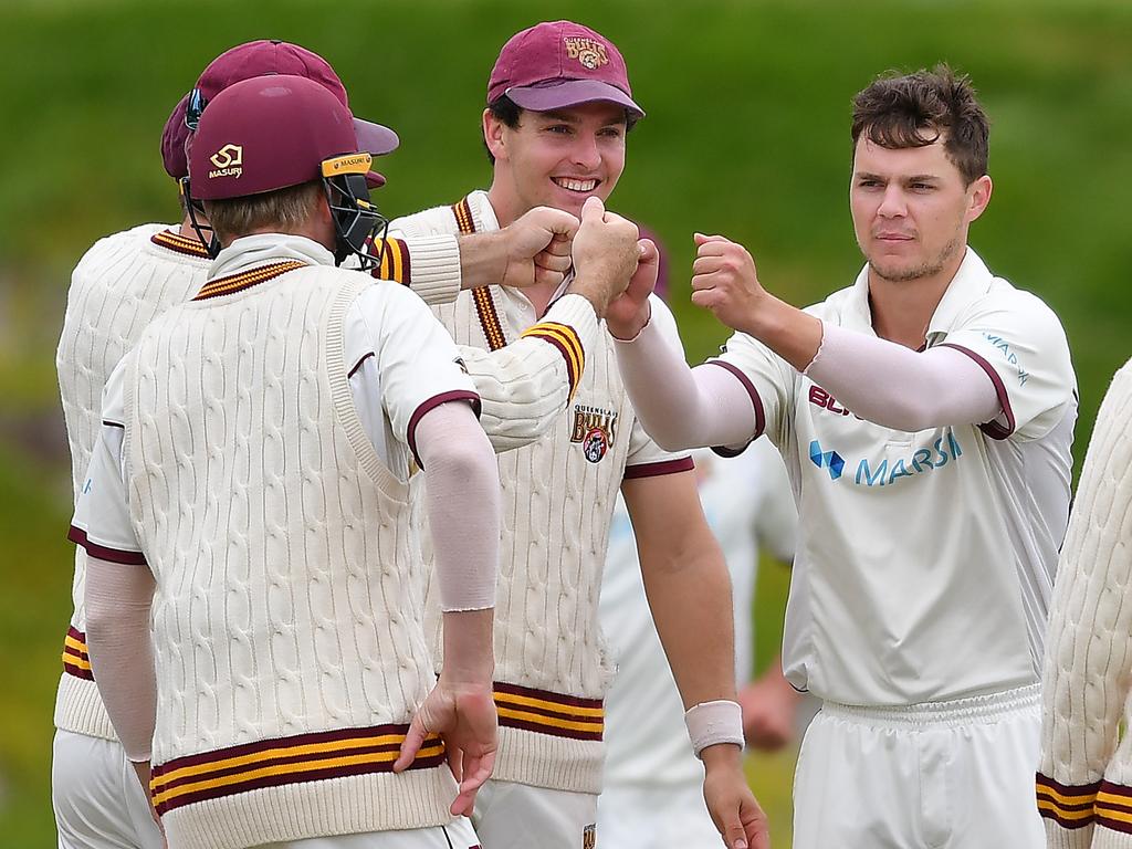 Mitchell Swepson of the Queensland Bulls celebrates the wicket of Kurtis Patterson.