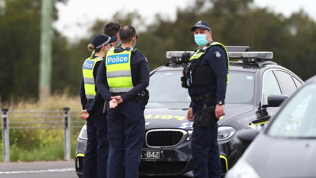 Police and Army personnel man a checkpoint on the Princes Freeway between Melbourne and Geelong. Picture: Aaron Francis/The Australian