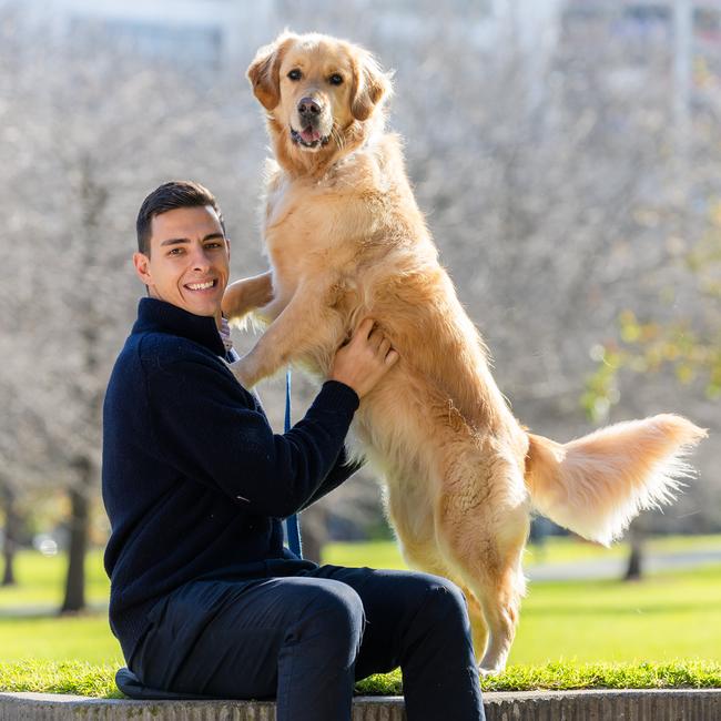 Anthony and his golden retriever Archie in Fawkner Park, South Yarra. Picture: Jason Edwards