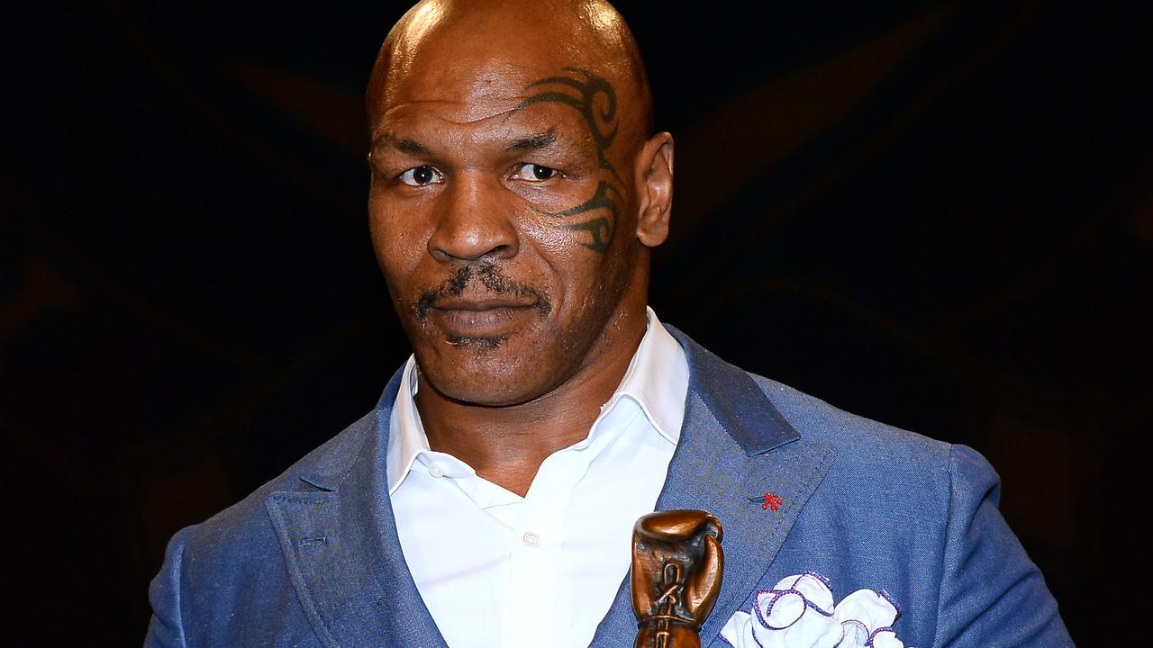 Former boxer Mike Tyson inducts Evander Holyfield into the Nevada Boxing Hall of Fame.