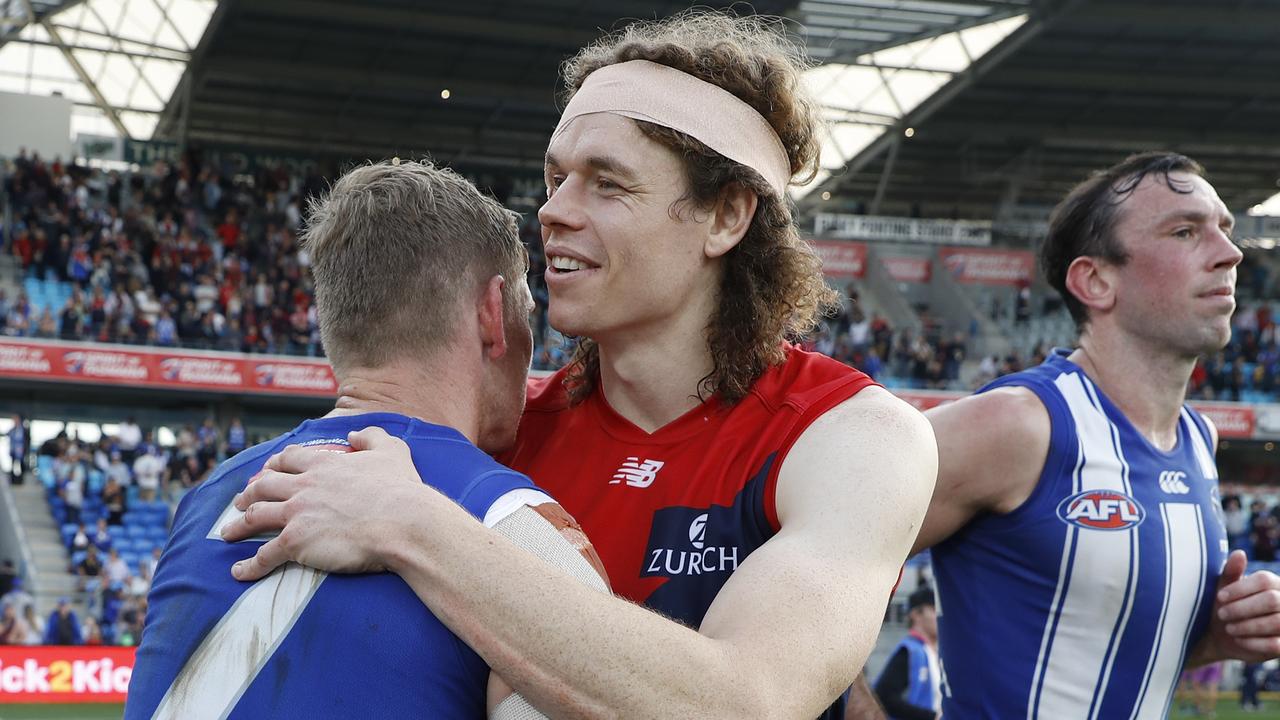 Ziebell shakes hands with Ben Brown last season, who the club traded at the end of 2020.