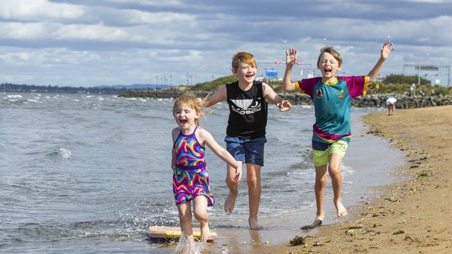 5 year old Mia, 10 year old Leroy and 9 year old Cayden Young enjoy the beach at Clontarf. Picture: Renae Droop