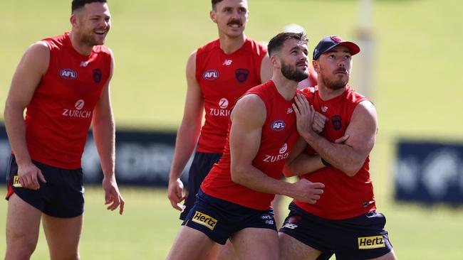 Michael Hibberd jostles with Jole Smith at Melbourne training.