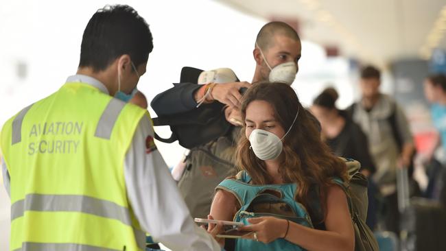 At Melbourne Airport social distancing measures are in place at security check points in preparation for the ramping up of air travel as restrictions ease. Picture: AFP