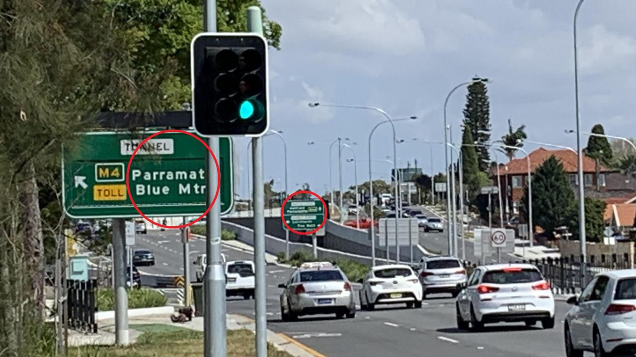 On Wattle St, two signs within metres of each other point to Parramatta. But they point in different directions.