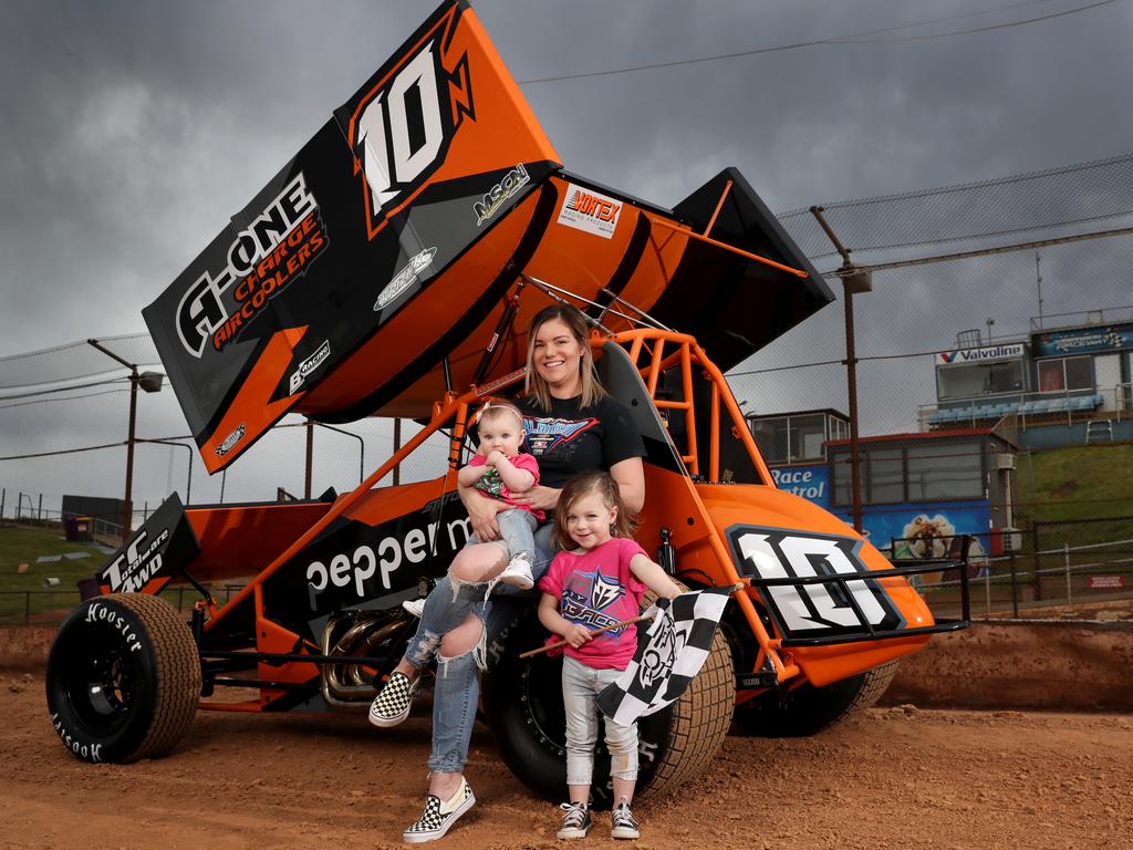 Sprint car driver Mikaela Darcy and her daughters, Callie 3 &amp; Addie (Addison) 8 months at the Sydney Speedway in Granville. Picture: Jonathan Ng