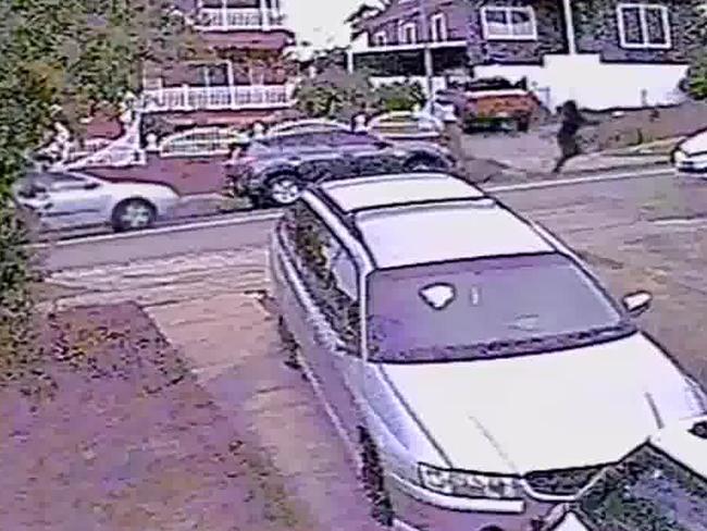 CCTV shows two masked men jumping out of a grey Toyota RAV4, before running across the road to carry out the shooting.