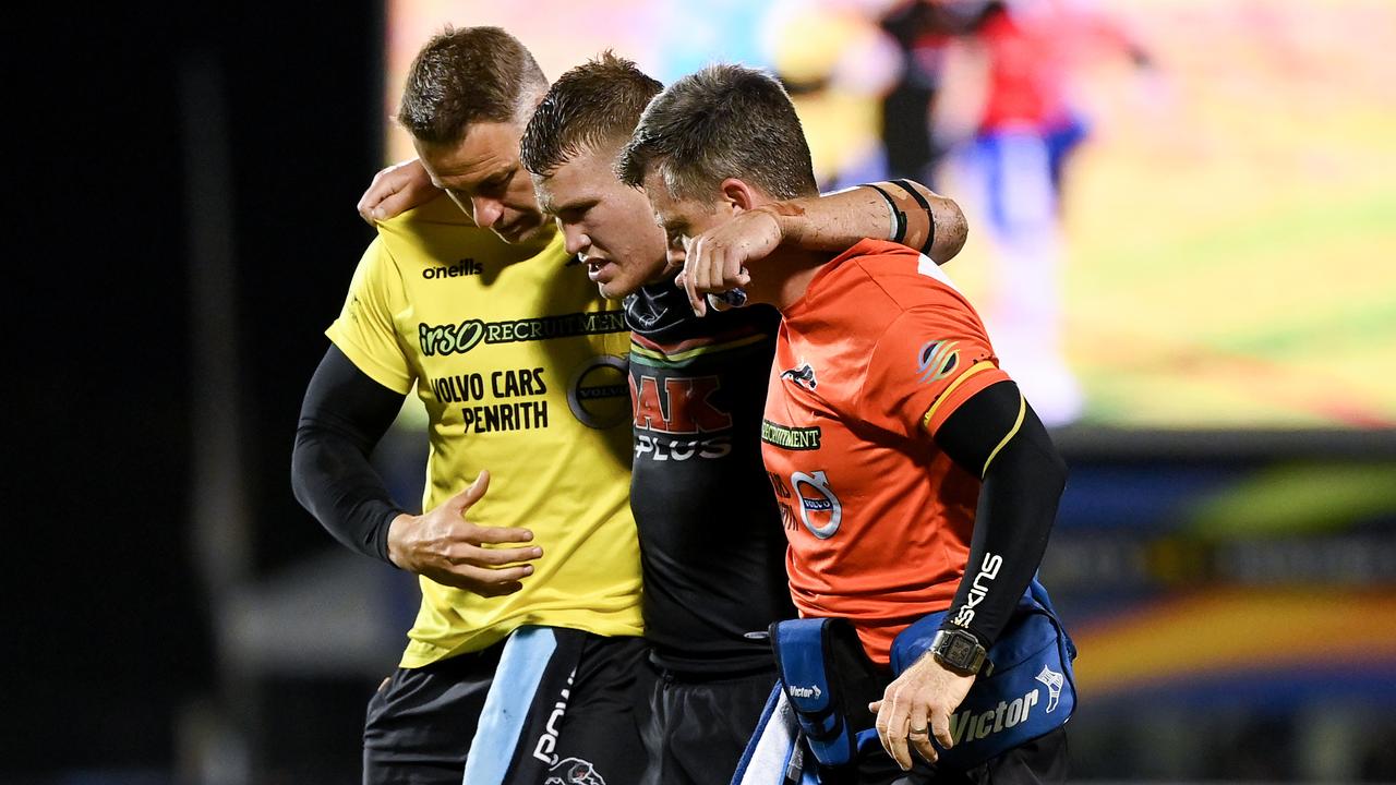 Penrith hooker Mitch Kenny is helped from the field.