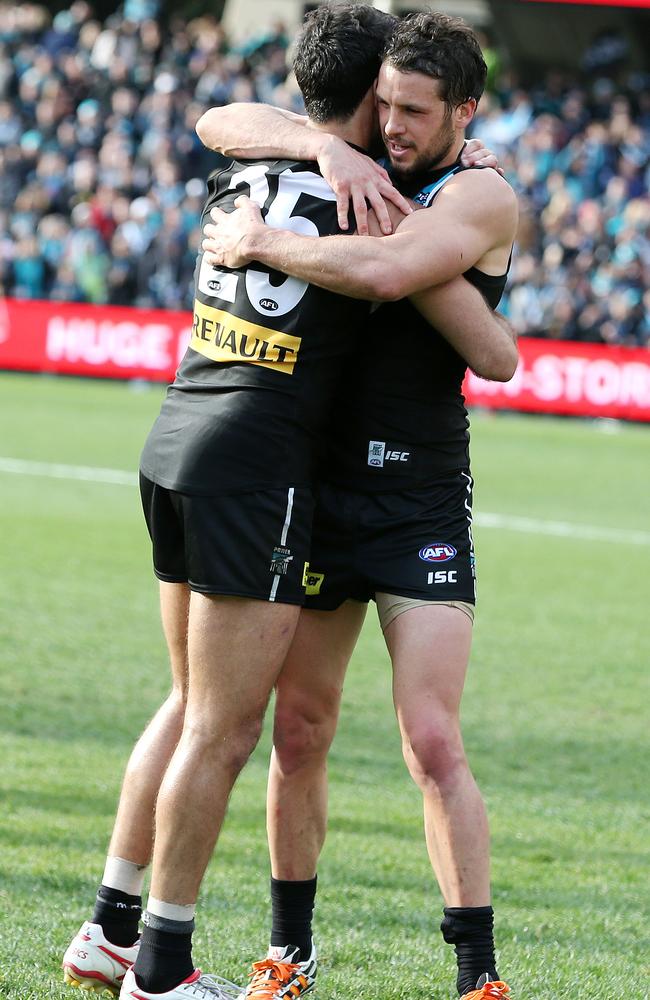 Former captain Dom Cassisi hugged by current captain Travis Boak at the end of the game. Photo Sarah Reed.