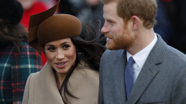 (FILES)  (L-R) US actress and fiancee of Britain's Prince Harry Meghan Markle and Britain's Prince Harry arrive to attend the Royal Family's traditional Christmas Day church service at St Mary Magdalene Church in Sandringham, Norfolk, eastern England, on December 25, 2017. (Photo by Adrian DENNIS / AFP)