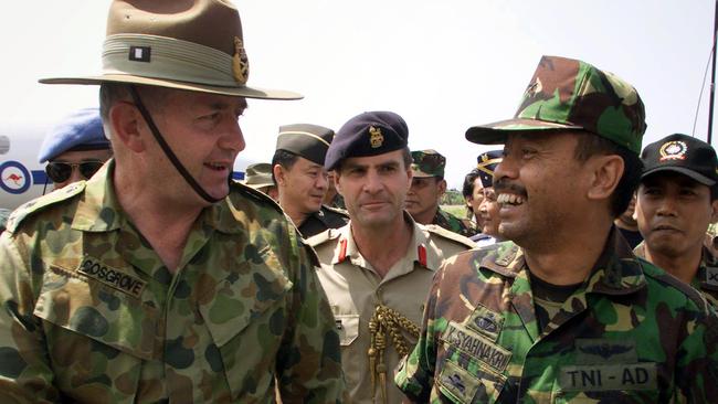 Chief of the UN peacekeeping force Peter Cosgrove, then a major general, meets with his Indonesian counterpart major general Syahnakri. Picture: AP