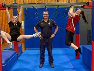 Ruby Johnson, Sgt Greg Jones and Amy English on the new ninja frame at the PCYC in North Rockhampton. Picture: Jann Houley