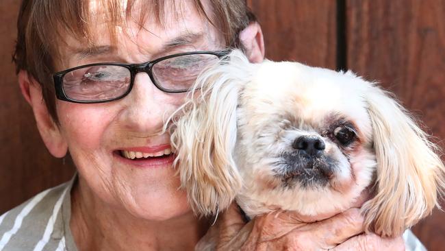 Eileen Graves reunited with her dog Romi at her Burleigh Heads Home. Photograph: Jason O'Brien