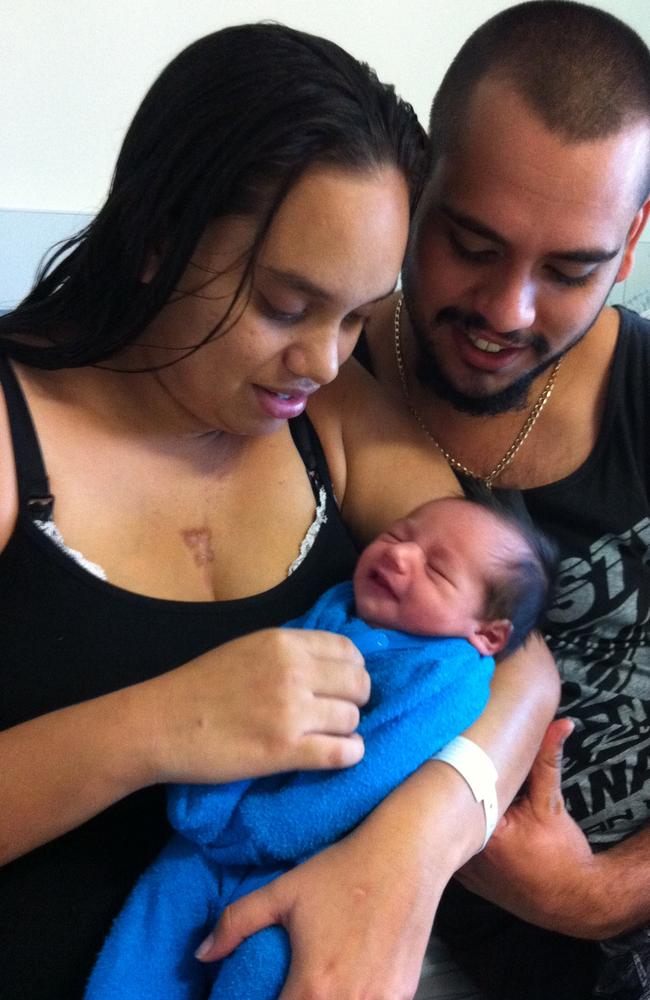 Daemarius as a newborn with his parents.