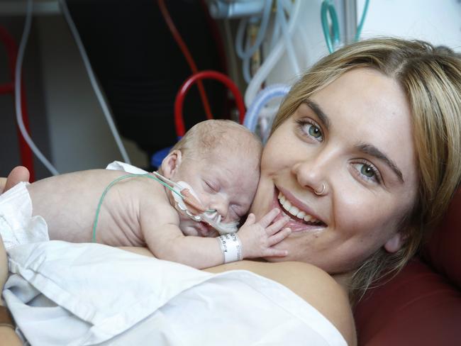 Premature Baby Ziggy, 36 weeks, is cuddled by his mother Jessica Holland at the Royal Women's Hospital. Picture: David Caird