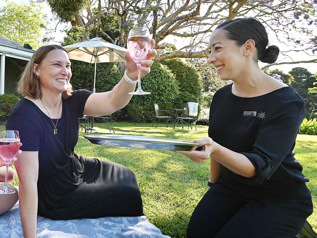 16/10/2020 :  Maleah Nelson treats guests (L) Cassie Atkins from Brisbane and Victoria McInnerney from Rockhampton, during their stay  at Spicers Clovelly at Montville, in the Sunshine Coast hinterland. Regional hotels are seeing occupancy soaring in contrast to their city cousins, which are struggling to sell rooms .  Pic Lyndon Mechielsen