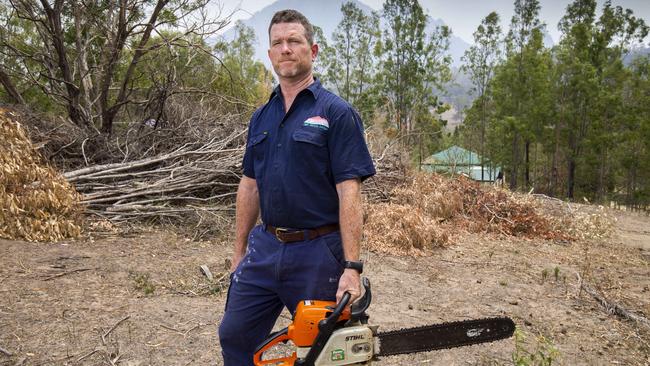 Mount Barney Lodge owner Innes Larkin carrying out hazard reduction before the oncoming bushfire. Picture: Glenn Hunt