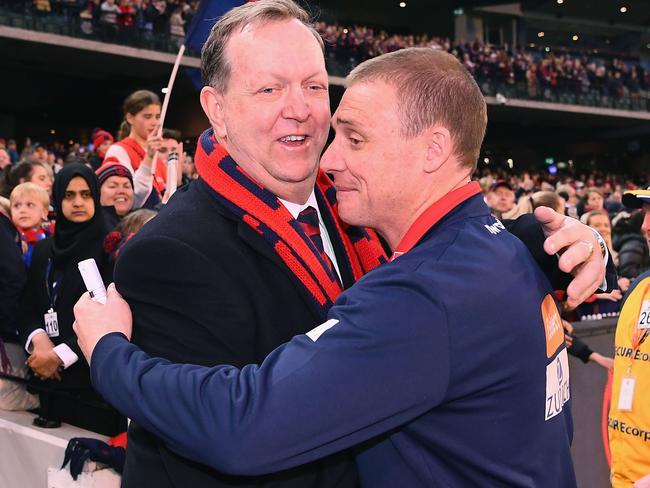 MELBOURNE, AUSTRALIA - AUGUST 26:  Glen Bartlett the President hugs Simon Goodwin the coach of the Demons after winning the round 23 AFL match between the Melbourne Demons and the Greater Western Sydney Giants at Melbourne Cricket Ground on August 26, 2018 in Melbourne, Australia.  (Photo by Quinn Rooney/Getty Images)