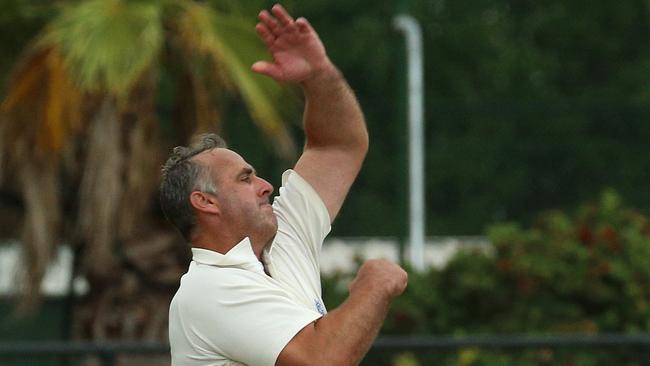 Craig Sheedy sends one down in the Sub-District Cricket grand final against Kew. Picture: Hamish Blair